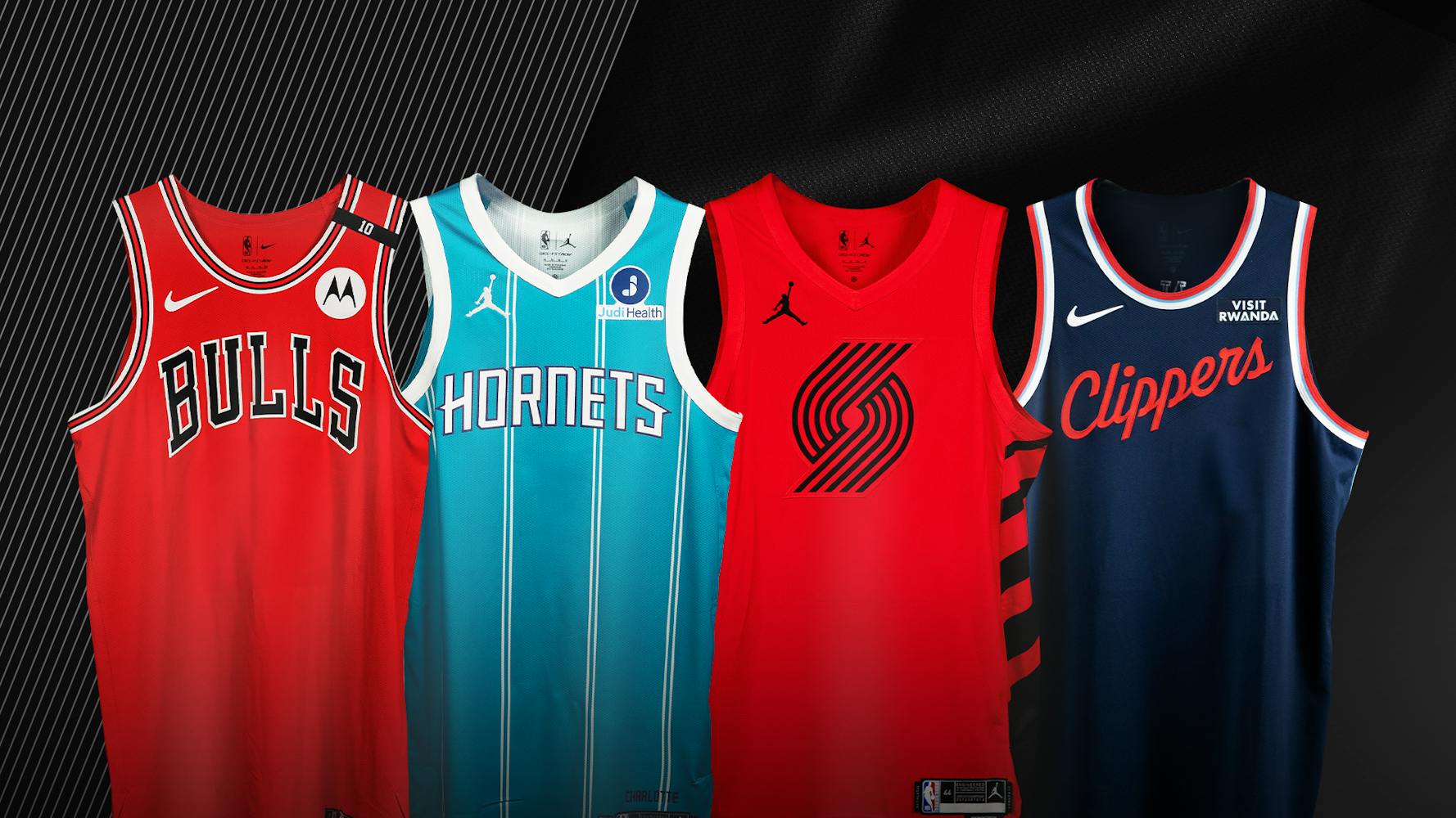 A photo of game-worn jerseys from the LA Clippers, Charlotte Hornets, Portland Trail Blazers, and Chicago Bulls