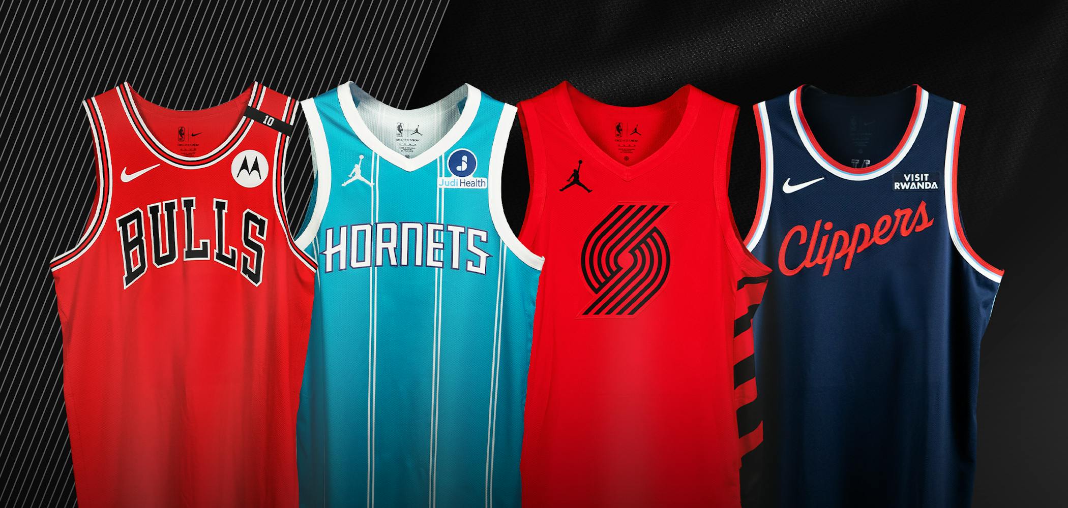 A photo of game-worn jerseys from the LA Clippers, Charlotte Hornets, Portland Trail Blazers, and Chicago Bulls